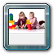 9006562-children-playing-with-blocks-isolated-on-white